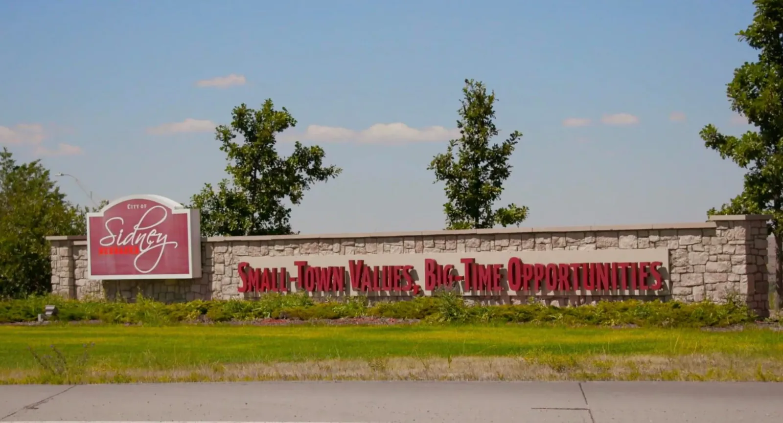 City of Sidney, Nebraska entrance sign reading Small-Town Values, Big-Time Opportunities